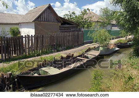 "Boat on canal in Vilkovo or Vylkove, also known as """"Ukrainian Venice"""", Ukraine, Eastern Europe, Europe" View Large Photo Image Picture - "Boat on canal in Vilkovo or Vylkove, also known as """"Ukrainian Venice"""", Ukraine, Eastern Europe, Europe". Fotosearch