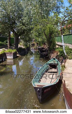 "Boat on canal in Vilkovo or Vylkove, also known as """"Ukrainian Venice"""", Ukraine, Eastern Europe, Europe" View Large Photo Image Stock Image - "Boat on canal in Vilkovo or Vylkove, also known as """"Ukrainian Venice"""", Ukraine, Eastern Europe, Europe". Fotosearch