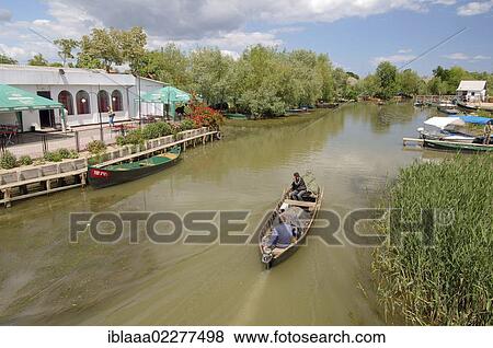 "Boat on canal in Vilkovo or Vylkove, also known as """"Ukrainian Venice"""", Ukraine, Eastern Europe, Europe" View Large Photo Image Stock Photo - "Boat on canal in Vilkovo or Vylkove, also known as """"Ukrainian Venice"""", Ukraine, Eastern Europe, Europe". Fotosearch
