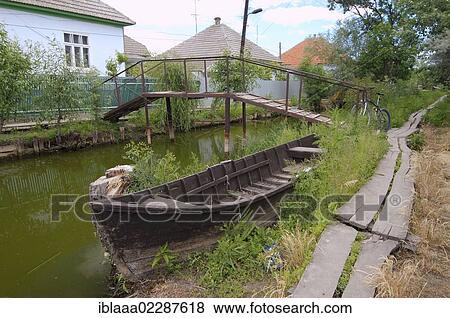 "Boat on canal in Vilkovo or Vylkove, also known as """"Ukrainian Venice"""", Ukraine, Eastern Europe, Europe" View Large Photo Image Stock Photo - "Boat on canal in Vilkovo or Vylkove, also known as """"Ukrainian Venice"""", Ukraine, Eastern Europe, Europe". Fotosearch