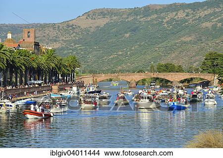 Picture - "Boat procession, Feast of the Virgin of Santa Maria del Mare on the river Temo, Bosa, Oristano Province, Sardinia, Italy, Europe". Fotosearch