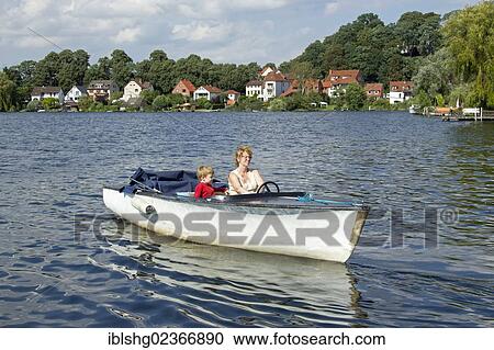 Stock Image - "Boat tour on Ziegelsee Lake, Moelln, Schleswig-Holstein, Germany, Europe". Fotosearch