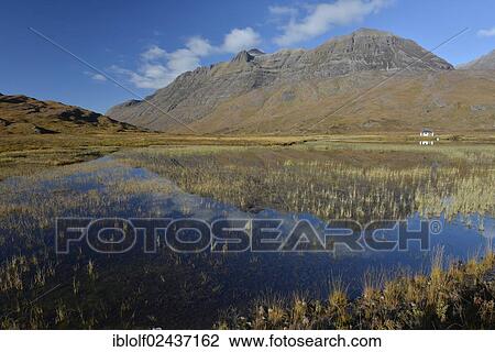 "Boathouse reflected in the lake in front of Liathach Mountain, Glen Torridon, Beinn Eighe National Nature Reserve SNH Kinlochewe, Scottish Highlands, Western Ross, Scotland, United Kingdom, Europe" View Large Photo Image Stock Image - "Boathouse reflected in the lake in front of Liathach Mountain, Glen Torridon, Beinn Eighe National Nature Reserve SNH Kinlochewe, Scottish Highlands, Western Ross, Scotland, United Kingdom, Europe". Fotosearch