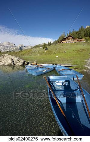 "Boats and an inn, Oeschinensee lake, Kandersteg, Bernese Oberland, Canton of Bern, Switzerland, Europe" View Large Photo Image Stock Photograph - "Boats and an inn, Oeschinensee lake, Kandersteg, Bernese Oberland, Canton of Bern, Switzerland, Europe". Fotosearch