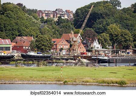 "Boats and shipyard with crane, Elbe river, Lauenburg Elbe, Lauenburg district, Schleswig-Holstein, Germany, Europe" View Large Photo Image Picture - "Boats and shipyard with crane, Elbe river, Lauenburg Elbe, Lauenburg district, Schleswig-Holstein, Germany, Europe". Fotosearch
