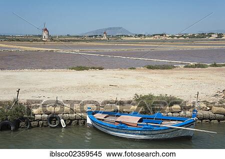 Stock Photography - "Boats and windmills, salines of Marsala, Trapani Province, Sicily, Italy, Europe". Fotosearch