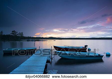 "Boats at the jetty at sunset on lake Skarvsjo, Asenhoga, Gnosjo, Jonkoping County, Sweden, Europe" View Large Photo Image Stock Image - "Boats at the jetty at sunset on lake Skarvsjo, Asenhoga, Gnosjo, Jonkoping County, Sweden, Europe". Fotosearch