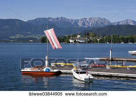 "Boats at the jetty, Schloss Ort castle at the back, lake Traunsee, Gmunden, Salzkammergut, Upper Austria, Austria, Europe" View Large Photo Image Stock Photography - "Boats at the jetty, Schloss Ort castle at the back, lake Traunsee, Gmunden, Salzkammergut, Upper Austria, Austria, Europe". Fotosearch