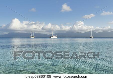 Stock Photo - "Boats, crystal clear water, Cayos Los Grullos island, San Blas Islands, Panama, North America". Fotosearch