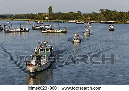 Stock Image - "Boats decorated at the 42nd Pardon de marines, pilgrimage of the boatmen on the Saone and its banks, Saint-Jean-de-Losne, Dijon, Burgundy, Cote d'Or department, France, Europe". Fotosearch