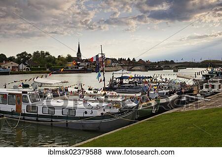 Stock Photo - "Boats decorated for the 42nd Pardon de marines, pilgrimage of the boatmen on the Saone and its banks, Saint-Jean-de-Losne, Dijon, Burgundy, Cote d'Or department, France, Europe". Fotosearch