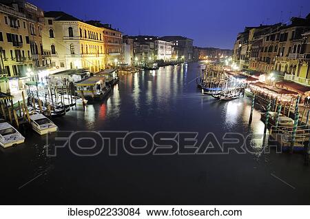 Picture - "Boats, gondolas on the Grand Canal, Canal Grande, from Rialto Bridge, Palazzo Dolfin Manin, Palazzo Barbarigo, at night, Venice, Venezia, Veneto, Italy, Europe". Fotosearch