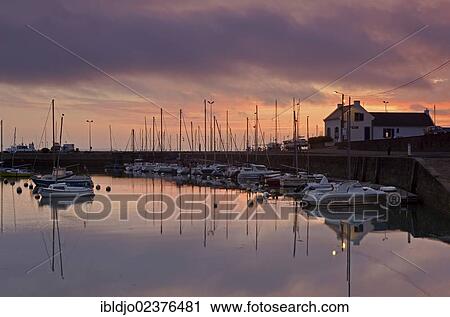 "Boats in the eastern harbour in front of a colorful sunrise sky, Port-Haliguen in Quiberon, southern Brittany, Bretagne, France, Europe" View Large Photo Image Stock Image - "Boats in the eastern harbour in front of a colorful sunrise sky, Port-Haliguen in Quiberon, southern Brittany, Bretagne, France, Europe". Fotosearch