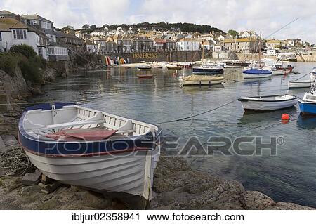 Stock Image - "Boats in the harbor of Mousehole, Cornwall, England, Great Britain, Europe". Fotosearch