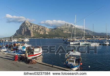 Picture - "Boats in the harbor of San Vito Lo Capo, climbing rock Monte Monaco at back, San Vito lo Capo, Nordwest- Kuste, Provinz Trapani, Sicily, Italy, Europe". Fotosearch
