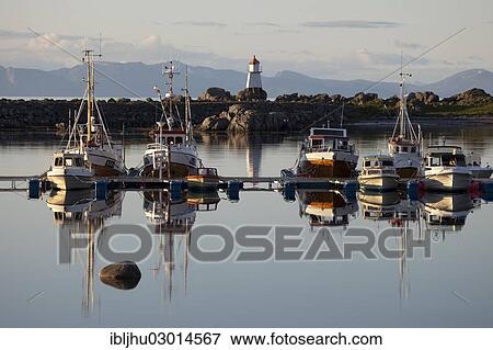 "Boats in the harbour and Hov Lighthouse in the evening light, Hovsund, Hov, Gimsoya, Gimsoya, Lofoten, Nordland, Northern Norway, Norway, Europe" View Large Photo Image Stock Photo - "Boats in the harbour and Hov Lighthouse in the evening light, Hovsund, Hov, Gimsoya, Gimsoya, Lofoten, Nordland, Northern Norway, Norway, Europe". Fotosearch