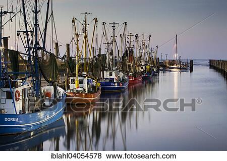 Stock Photo - "Boats in the harbour, Dorum-Neufeld, Schleswig-Holstein, Germany, Europe". Fotosearch