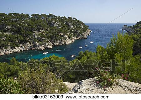 Stock Photo - "Boats in the rocky bay Calanque de Port-Pin, Calanques National Park, Cassis, Departement Bouches-du-Rhone, Region Provence-Alpes-Cote d? ÇÖAzur d? ÇÖAzur, France, Europe". Fotosearch