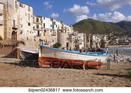 Stock Photo - "Boats, medieval houses and seafront of old Cefalu, Sicily, Italy, Europe". Fotosearch