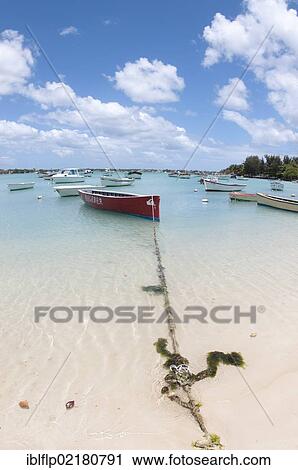 "Boats moored beside sandy beach, West Mauritius, Africa" View Large Photo Image Stock Image - "Boats moored beside sandy beach, West Mauritius, Africa". Fotosearch