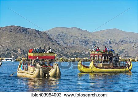 "Boats off the floating islands of the Uros on Lake Titicaca, Peru, South America" View Large Photo Image Stock Image - "Boats off the floating islands of the Uros on Lake Titicaca, Peru, South America". Fotosearch