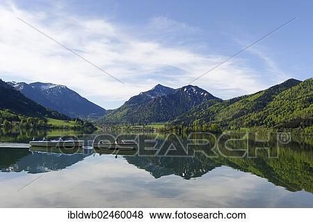 "Boats on lake Schliersee in spring, Brecherspitze mountain at the back, Upper Bavaria, Bavaria, Germany, Europe" View Large Photo Image Stock Photo - "Boats on lake Schliersee in spring, Brecherspitze mountain at the back, Upper Bavaria, Bavaria, Germany, Europe". Fotosearch