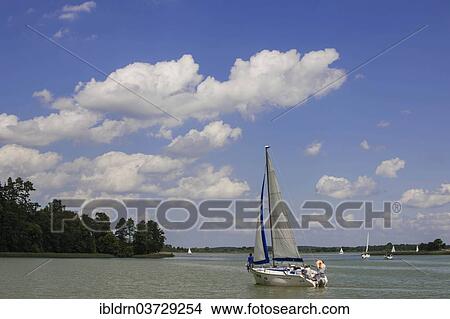 "Boats on Lake Sniardwy or Jezioro Åšniardwy, Masurian Lake District or Masurian Lakeland, Mikolajki, Warmian-Masurian Voivodeship, Poland, Europe" View Large Photo Image Picture - "Boats on Lake Sniardwy or Jezioro Åšniardwy, Masurian Lake District or Masurian Lakeland, Mikolajki, Warmian-Masurian Voivodeship, Poland, Europe". Fotosearch