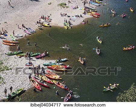 Stock Photo - "Boats on the beach on the Ardeche river, near Vallon-Pont-d'Arc, Ardeche, Rhone-Alpes, France, Europe". Fotosearch