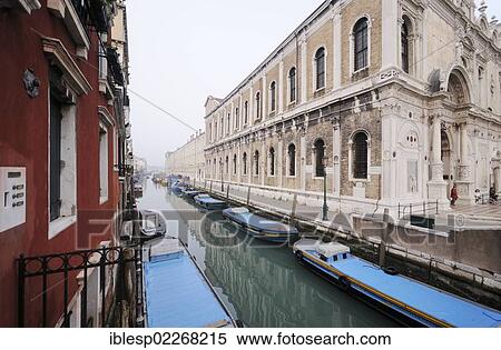 Stock Photography - "Boats on the canal of Rio dei Mendicanti, Scuola Grande di San Marco, Castello, Venice, Venezia, Veneto, Italy, Europe". Fotosearch