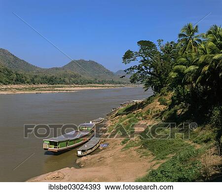 "Boats on the shore of the Mekong River, Luang Prabang, Luang Prabang Province, Laos, Asia" View Large Photo Image Stock Image - "Boats on the shore of the Mekong River, Luang Prabang, Luang Prabang Province, Laos, Asia". Fotosearch