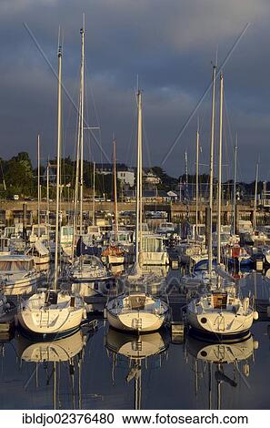 Stock Image - "Boats reflected in the eastern harbor in the early morning, Port-Haliguen in Quiberon, southern Brittany, Bretagne, France, Europe". Fotosearch