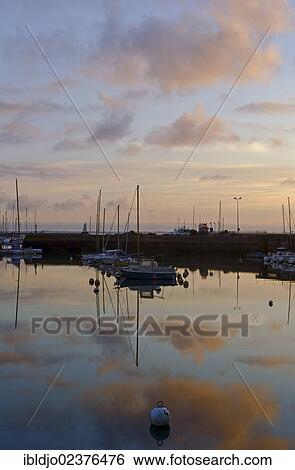 "Boats reflected in the eastern harbor in the early morning, Port-Haliguen in Quiberon, southern Brittany, Bretagne, France, Europe" View Large Photo Image Stock Photograph - "Boats reflected in the eastern harbor in the early morning, Port-Haliguen in Quiberon, southern Brittany, Bretagne, France, Europe". Fotosearch