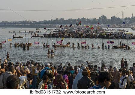 Stock Image - "Boats to ship people to the Sangam, the confluence of the rivers Ganges, Yamuna and Saraswati, during Kumbha Mela, Allahabad, Uttar Pradesh, India, Asia". Fotosearch
