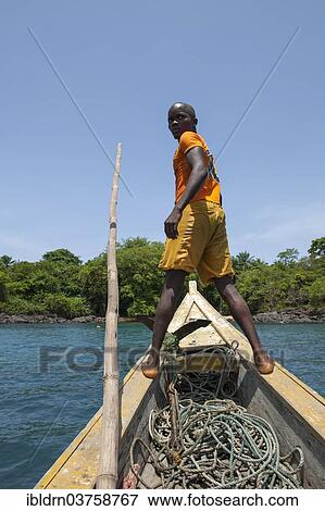 "Boatsman looking for a suitable place to dock, Banana Islands, Western Area, Sierra Leone, Africa" View Large Photo Image Stock Photo - "Boatsman looking for a suitable place to dock, Banana Islands, Western Area, Sierra Leone, Africa". Fotosearch
