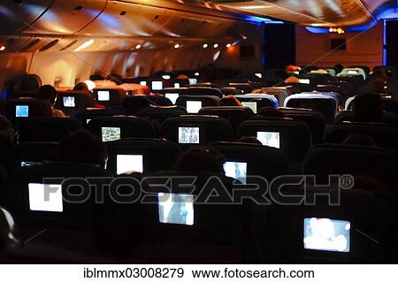 "Boeing 777, Economy Class, inflight entertainment in the aircraft at night" View Large Photo Image Stock Photo - "Boeing 777, Economy Class, inflight entertainment in the aircraft at night". Fotosearch