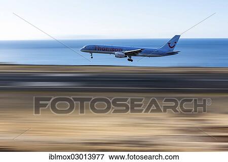 Stock Photo - "Boeing from Thomson TUI1 approaching the runway of Madeira Airport, LPMA, also known as Funchal Airport and Santa Catarina Airport, Santa Catarina, Funchal, Madeira, Portugal, Europe". Fotosearch