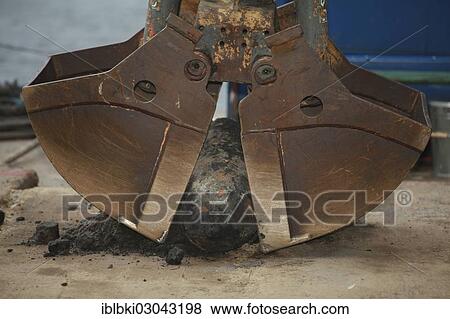 "Bomb from the Second World War between the buckets of an excavator, discovered during dredging works, Berlin-Kreuzberg, Berlin, Berlin, Germany, Europe" View Large Photo Image Stock Photo - "Bomb from the Second World War between the buckets of an excavator, discovered during dredging works, Berlin-Kreuzberg, Berlin, Berlin, Germany, Europe". Fotosearch