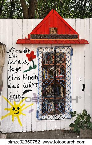 "Bookshelf in a wooden wall on a street, free book exchange, Greifswald, Mecklenburg-Western Pomerania, Germany, Europe" View Large Photo Image Stock Image - "Bookshelf in a wooden wall on a street, free book exchange, Greifswald, Mecklenburg-Western Pomerania, Germany, Europe". Fotosearch