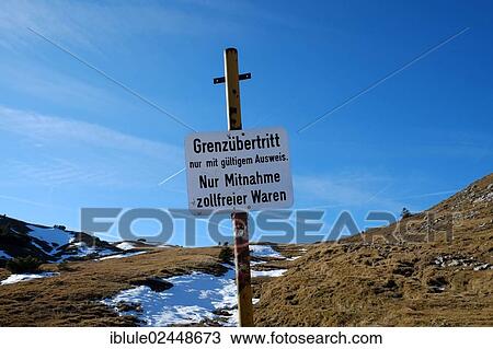 Stock Image - "Border sign between Bavaria and Austria, Aschau, Klausberg, Chiemgau Alps, Bavaria, Germany, Europe". Fotosearch
