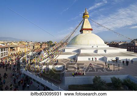 "Boudnath Stupa with prayer flags, some visitors and surrounding buildings, Kathmandu Valley, Kathmandu, Kathmandu District, Bagmati Zone, Nepal, Asia" View Large Photo Image Stock Image - "Boudnath Stupa with prayer flags, some visitors and surrounding buildings, Kathmandu Valley, Kathmandu, Kathmandu District, Bagmati Zone, Nepal, Asia". Fotosearch