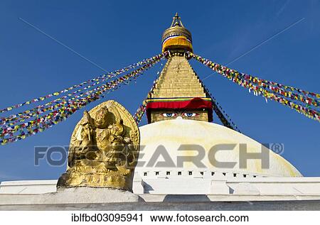Stock Image - "Boudnath Stupa with statue of a goddess, prayer flags and blue sky, Kathmandu Valley, Kathmandu, Kathmandu District, Bagmati Zone, Nepal, Asia". Fotosearch