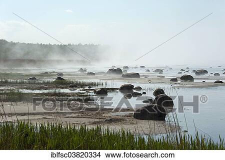 Picture - "Boulders in the mist of the Baltic Sea, Altja, Lahemaa National Park, Estonia, Baltic States, Europe". Fotosearch
