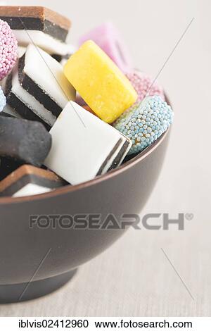 Bowl filled with liquorice candy View Large Photo Image Stock Image - Bowl filled with liquorice candy. Fotosearch