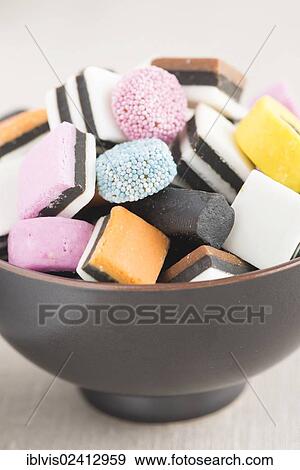 Bowl filled with liquorice candy View Large Photo Image Stock Photo - Bowl filled with liquorice candy. Fotosearch
