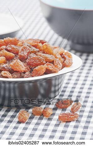Stock Photo - "Bowl filled with raisins, sultanas". Fotosearch