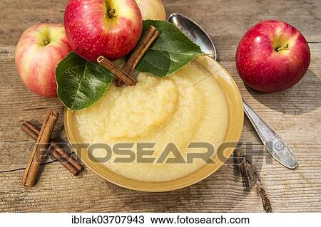 "Bowl of apple sauce and fresh apples and cinnamon sticks, Germany, Europe" View Large Photo Image Stock Image - "Bowl of apple sauce and fresh apples and cinnamon sticks, Germany, Europe". Fotosearch
