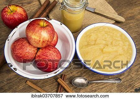 "Bowl of apple sauce and fresh apples and cinnamon sticks, Germany, Europe" View Large Photo Image Stock Photo - "Bowl of apple sauce and fresh apples and cinnamon sticks, Germany, Europe". Fotosearch
