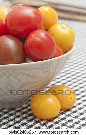 Bowl with different kinds of tomatoes View Large Photo Image Stock Photo - Bowl with different kinds of tomatoes. Fotosearch