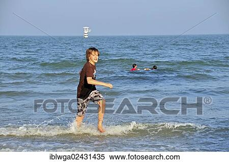 "Boy, 11 years, on the beach of Hua Hin, Thailand, Asia, PublicGround, Asia" View Large Photo Image Stock Photography - "Boy, 11 years, on the beach of Hua Hin, Thailand, Asia, PublicGround, Asia". Fotosearch