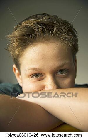 Stock Photograph - "Boy, 12, starting to have facial acne, puberty, Germany, Europe". Fotosearch